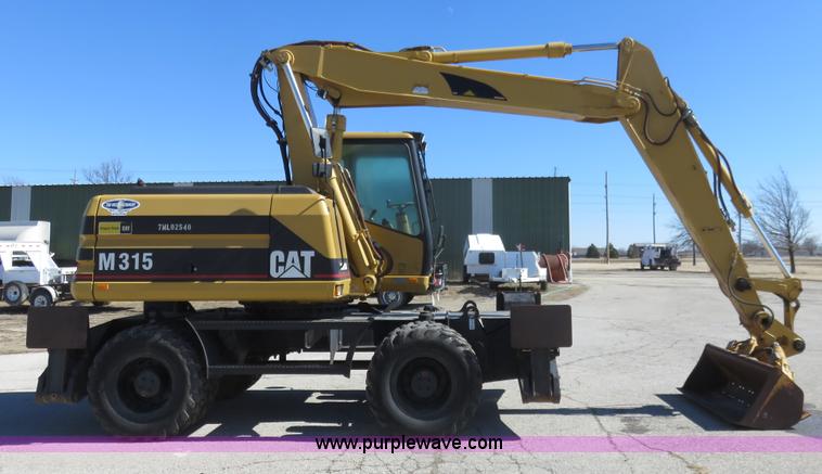 image for item K7107 2001 Caterpillar M315 rubber tire excavator