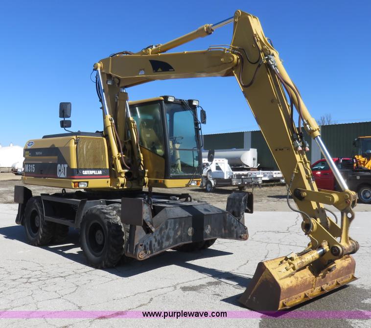 image for item K7107 2001 Caterpillar M315 rubber tire excavator