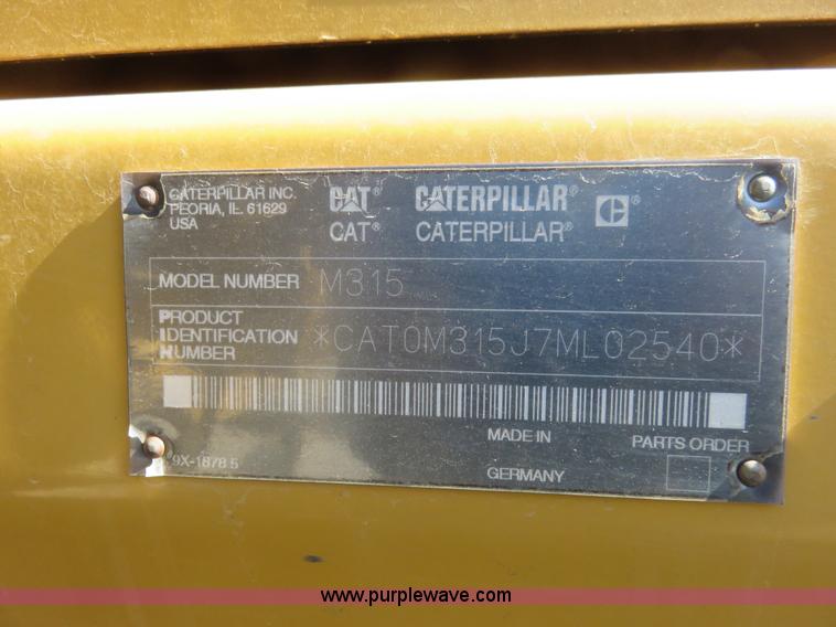 image for item K7107 2001 Caterpillar M315 rubber tire excavator