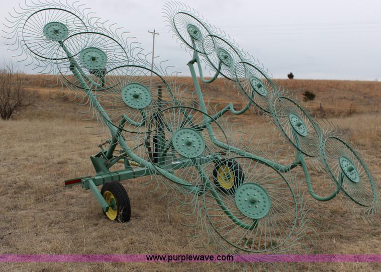 image for item F7567 John Deere 702 10 wheel hay rake