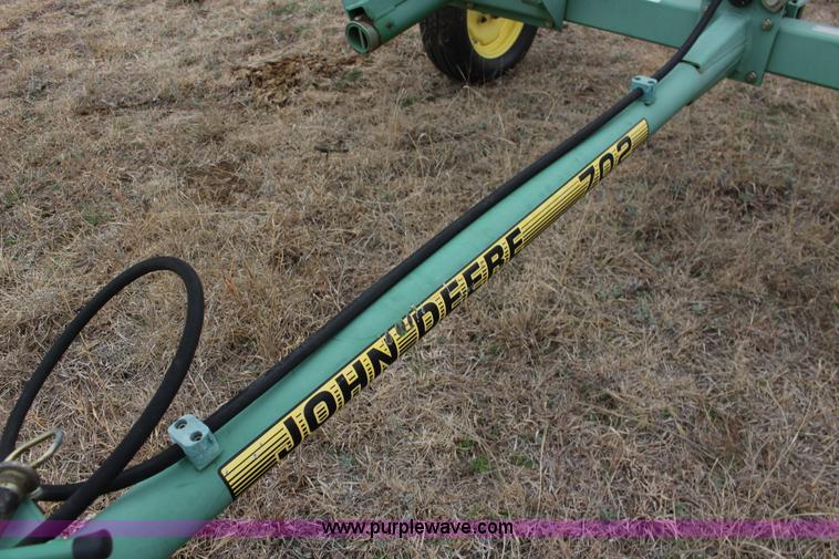 image for item F7567 John Deere 702 10 wheel hay rake