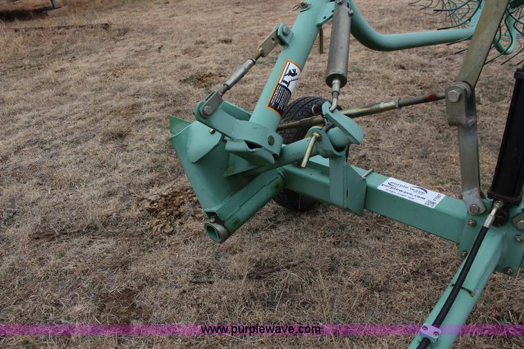 image for item F7567 John Deere 702 10 wheel hay rake