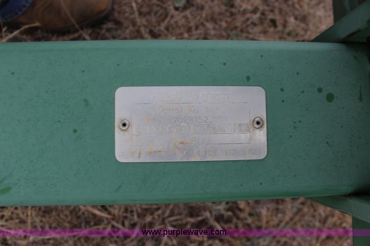 image for item F7567 John Deere 702 10 wheel hay rake