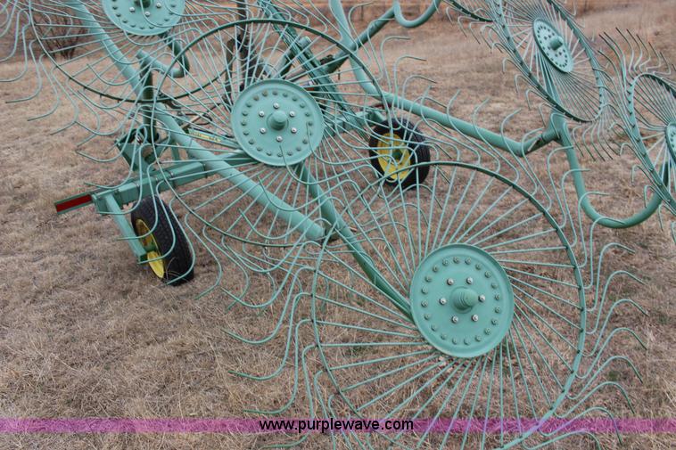 image for item F7567 John Deere 702 10 wheel hay rake