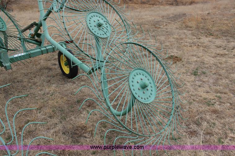 image for item F7567 John Deere 702 10 wheel hay rake