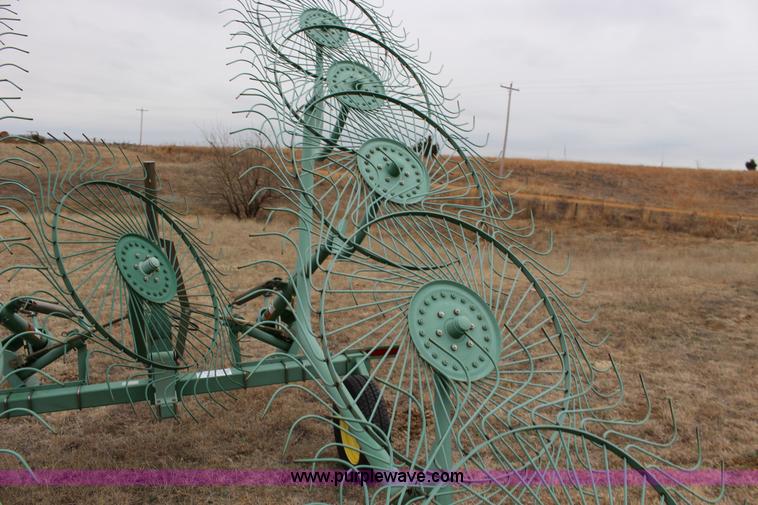 image for item F7567 John Deere 702 10 wheel hay rake