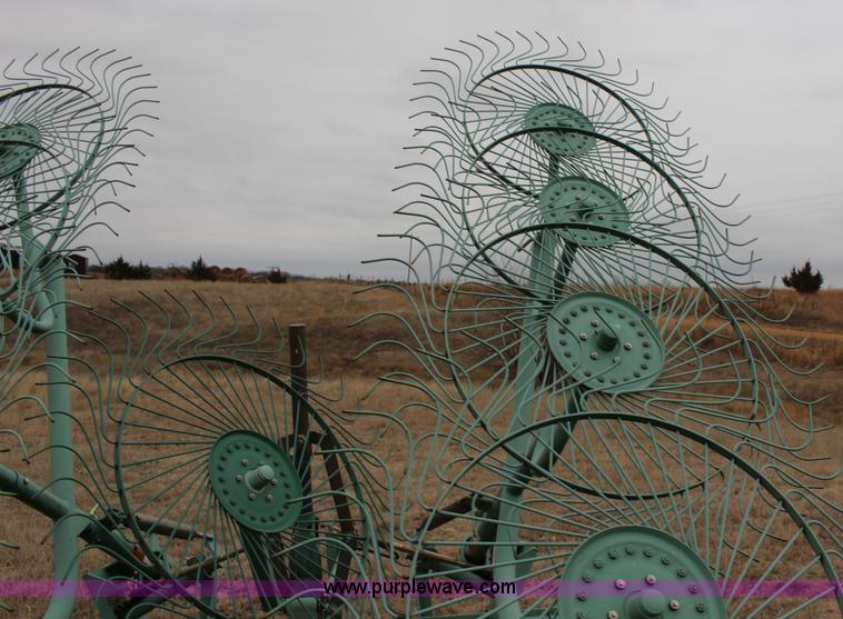 image for item F7567 John Deere 702 10 wheel hay rake