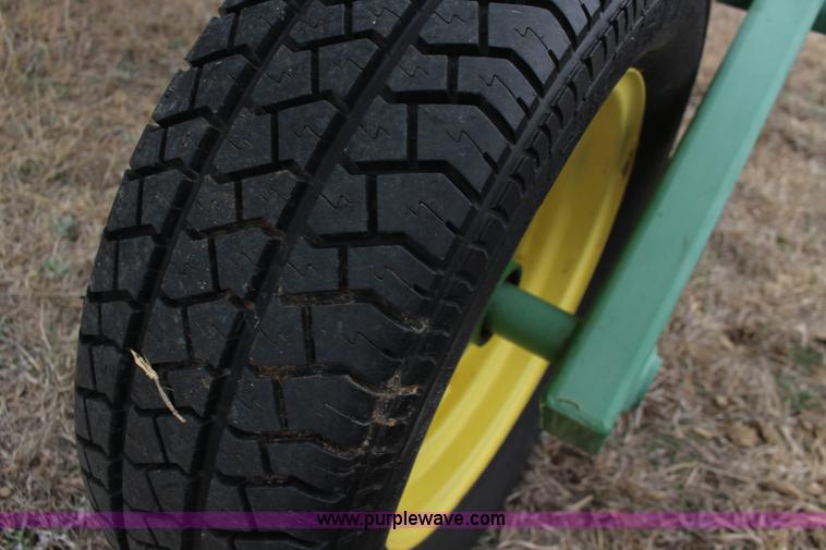 image for item F7567 John Deere 702 10 wheel hay rake