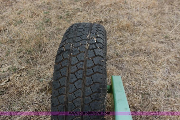 image for item F7567 John Deere 702 10 wheel hay rake