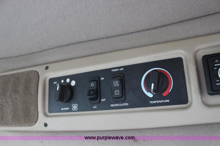 image for item F7654 2008 MacDon M150 self-propelled windrower