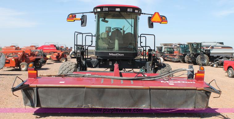 image for item H1559 2012 MacDon M205 self-propelled windrower