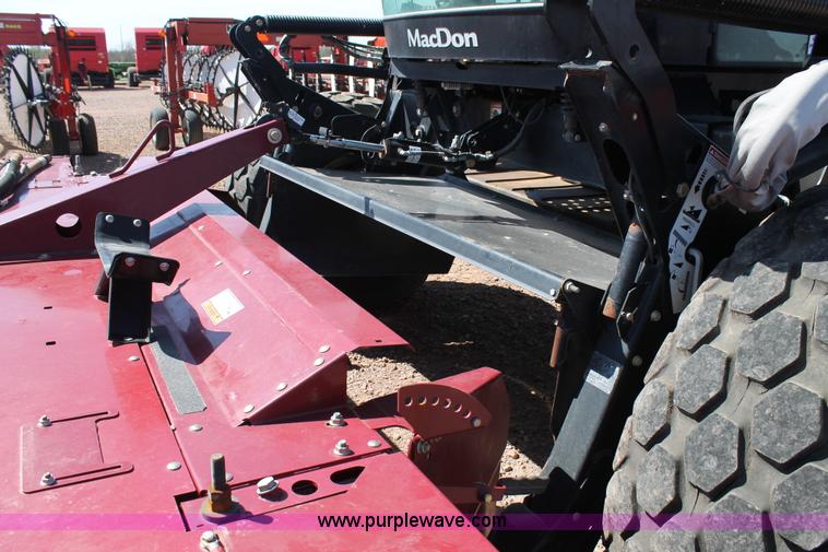 image for item H1559 2012 MacDon M205 self-propelled windrower