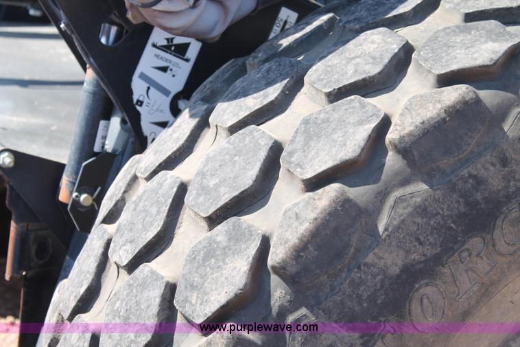 image for item H1559 2012 MacDon M205 self-propelled windrower