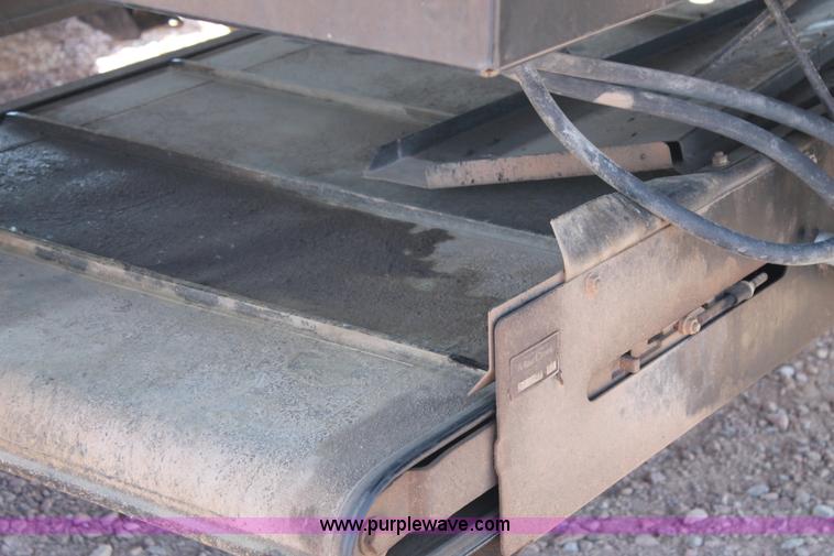 image for item H1559 2012 MacDon M205 self-propelled windrower