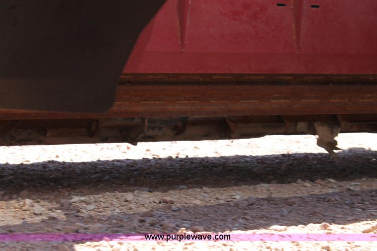 image for item H1559 2012 MacDon M205 self-propelled windrower