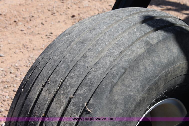 image for item H1559 2012 MacDon M205 self-propelled windrower