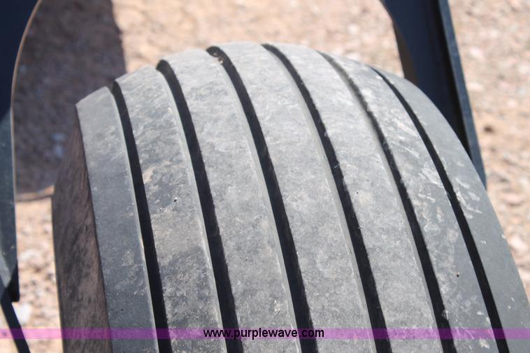 image for item H1559 2012 MacDon M205 self-propelled windrower