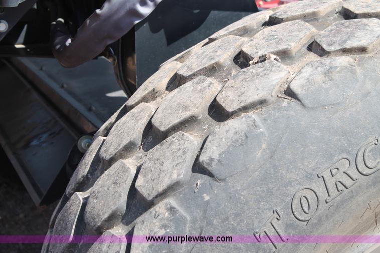 image for item H1559 2012 MacDon M205 self-propelled windrower