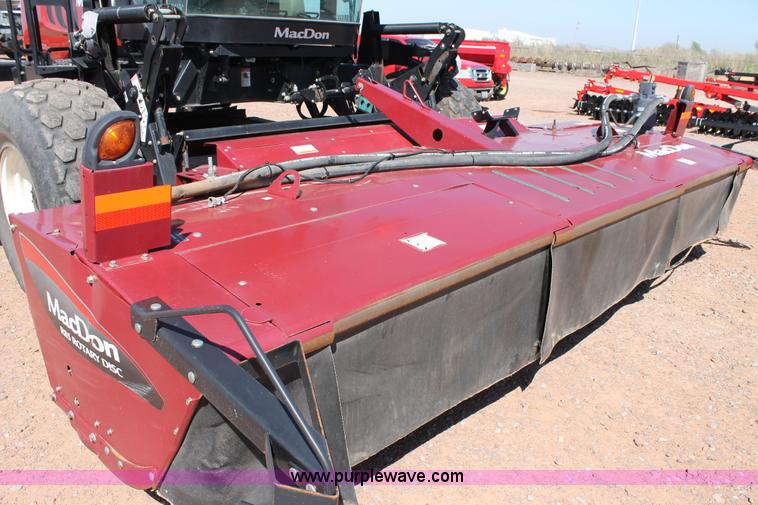 image for item H1559 2012 MacDon M205 self-propelled windrower