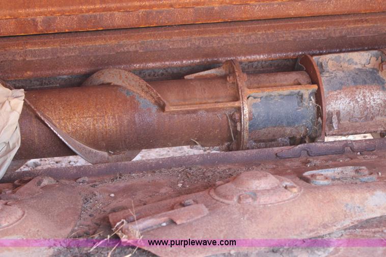 image for item H1559 2012 MacDon M205 self-propelled windrower