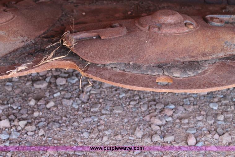 image for item H1559 2012 MacDon M205 self-propelled windrower