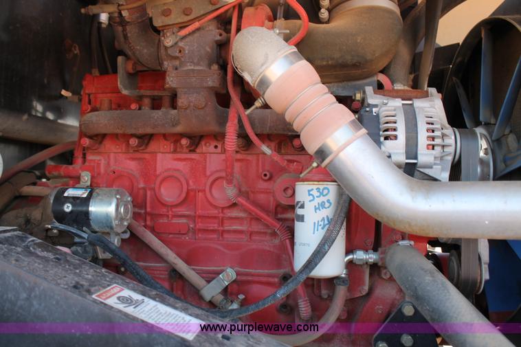 image for item H1559 2012 MacDon M205 self-propelled windrower