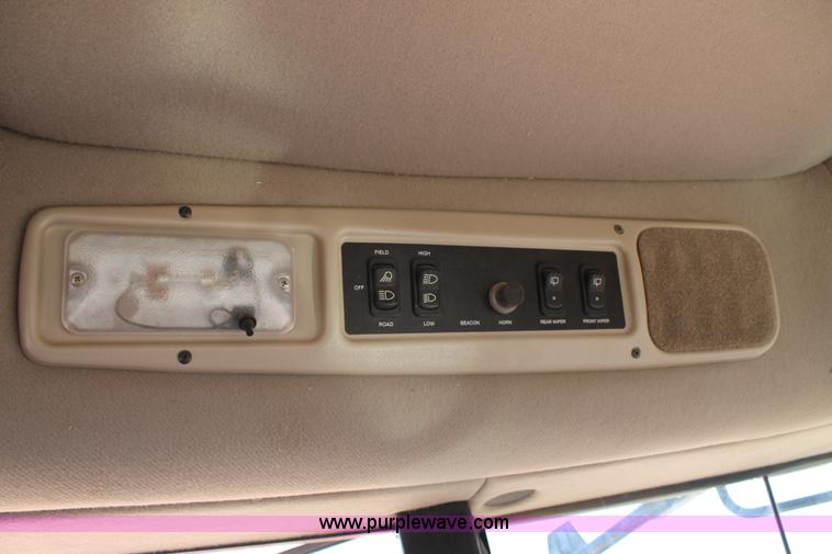 image for item H1559 2012 MacDon M205 self-propelled windrower