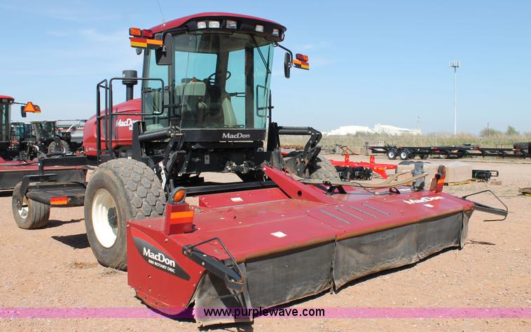 image for item H1560 2011 MacDon M205 self-propelled windrower