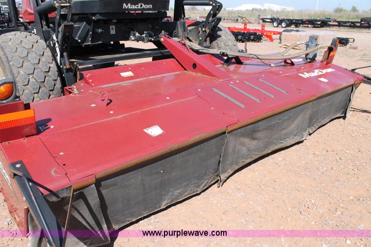 image for item H1560 2011 MacDon M205 self-propelled windrower