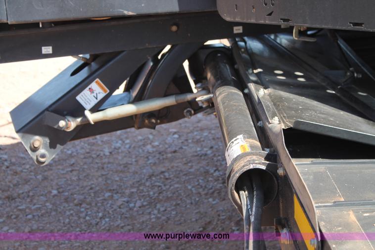 image for item H1560 2011 MacDon M205 self-propelled windrower