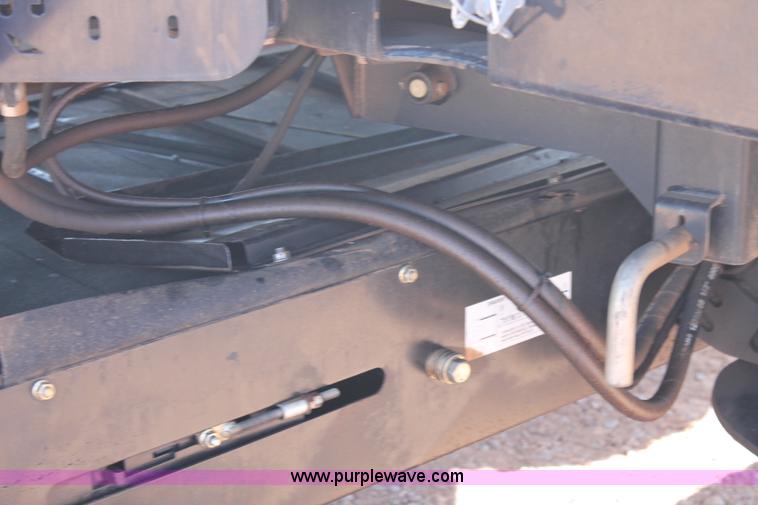 image for item H1560 2011 MacDon M205 self-propelled windrower