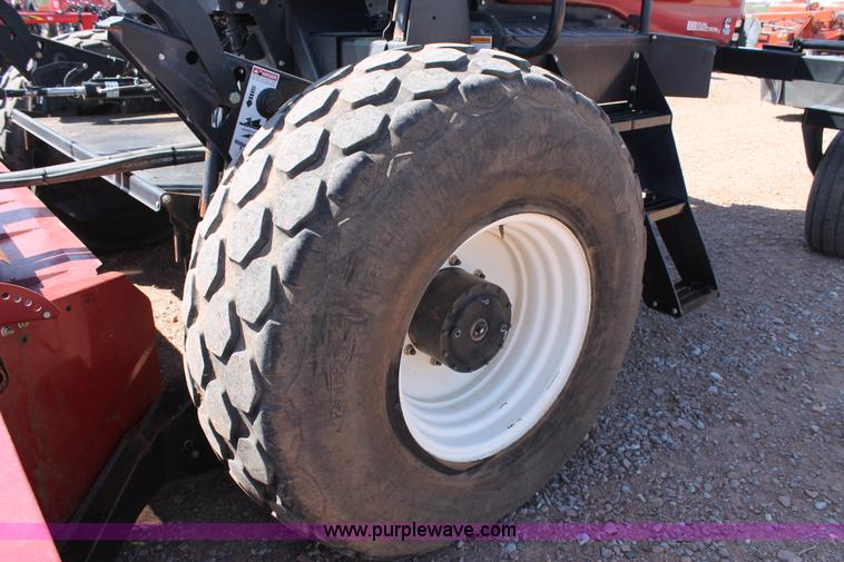 image for item H1560 2011 MacDon M205 self-propelled windrower