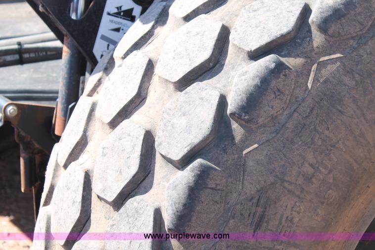 image for item H1560 2011 MacDon M205 self-propelled windrower