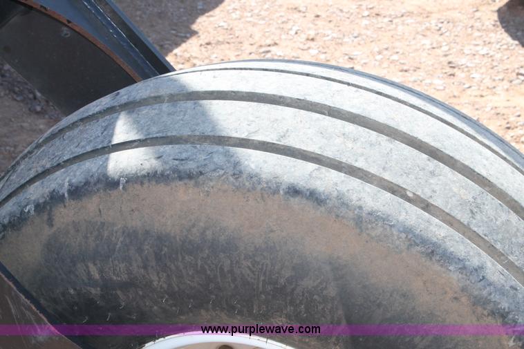 image for item H1560 2011 MacDon M205 self-propelled windrower