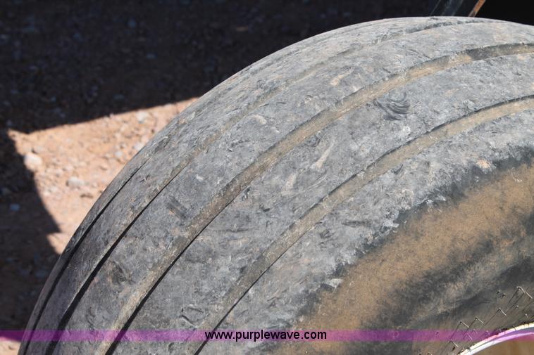 image for item H1560 2011 MacDon M205 self-propelled windrower