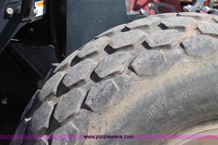 image for item H1560 2011 MacDon M205 self-propelled windrower