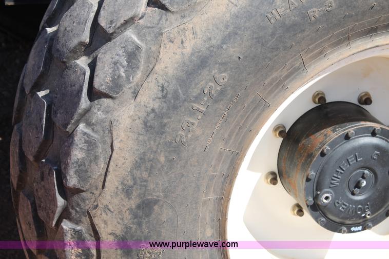 image for item H1560 2011 MacDon M205 self-propelled windrower