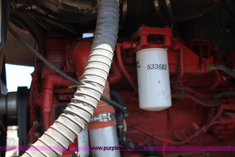 image for item H1560 2011 MacDon M205 self-propelled windrower