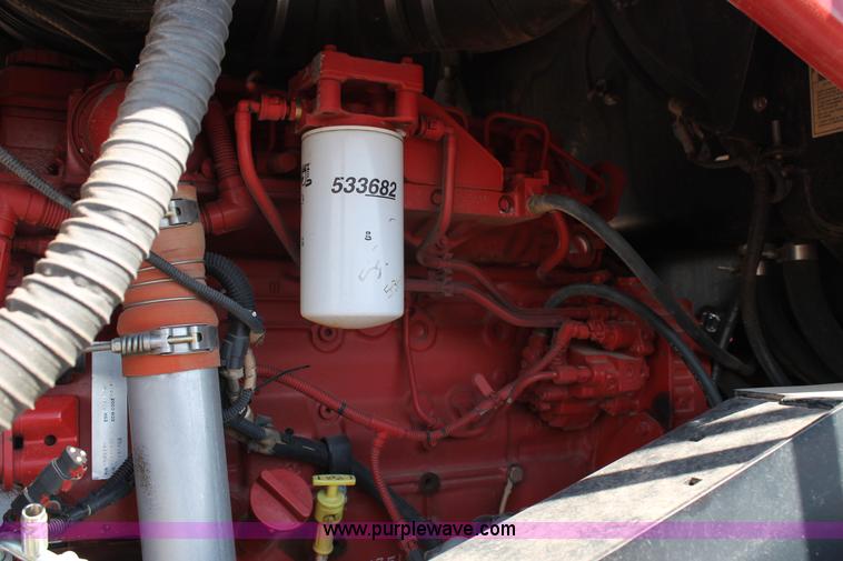 image for item H1560 2011 MacDon M205 self-propelled windrower