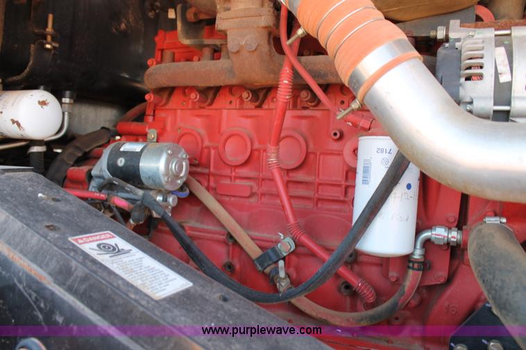 image for item H1560 2011 MacDon M205 self-propelled windrower