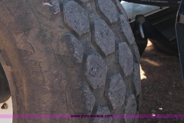 image for item H1560 2011 MacDon M205 self-propelled windrower