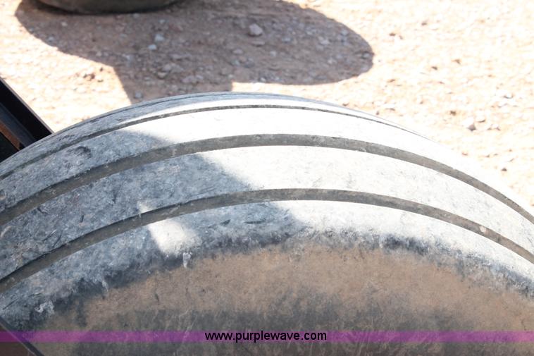 image for item H1560 2011 MacDon M205 self-propelled windrower