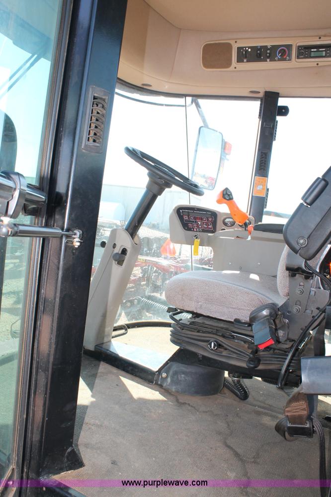 image for item H1560 2011 MacDon M205 self-propelled windrower