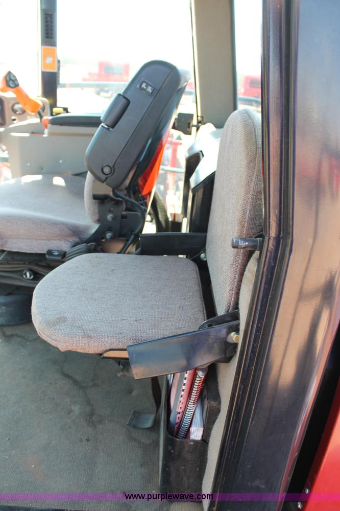 image for item H1560 2011 MacDon M205 self-propelled windrower