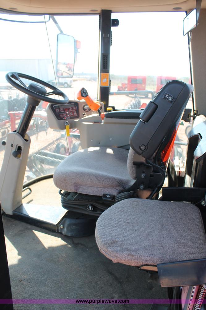 image for item H1560 2011 MacDon M205 self-propelled windrower