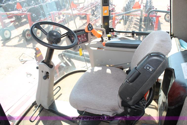 image for item H1560 2011 MacDon M205 self-propelled windrower