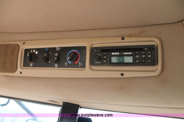 image for item H1560 2011 MacDon M205 self-propelled windrower