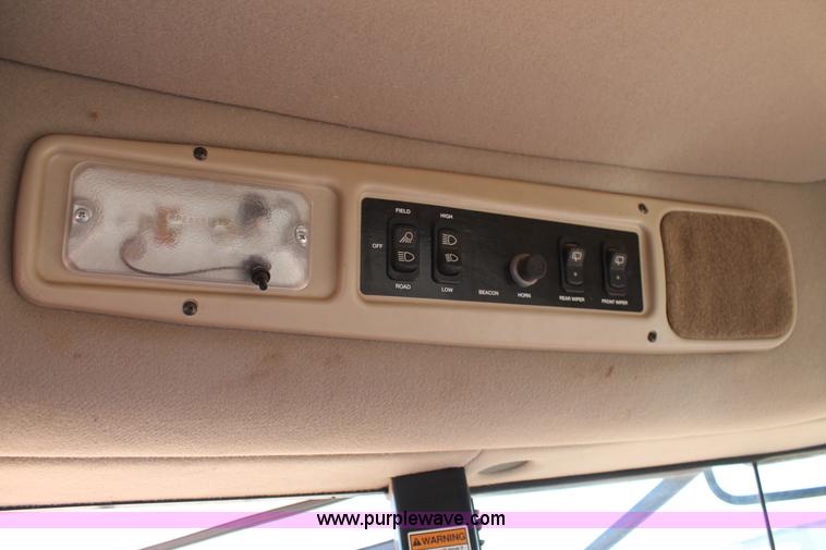 image for item H1560 2011 MacDon M205 self-propelled windrower