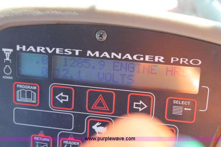 image for item H1560 2011 MacDon M205 self-propelled windrower