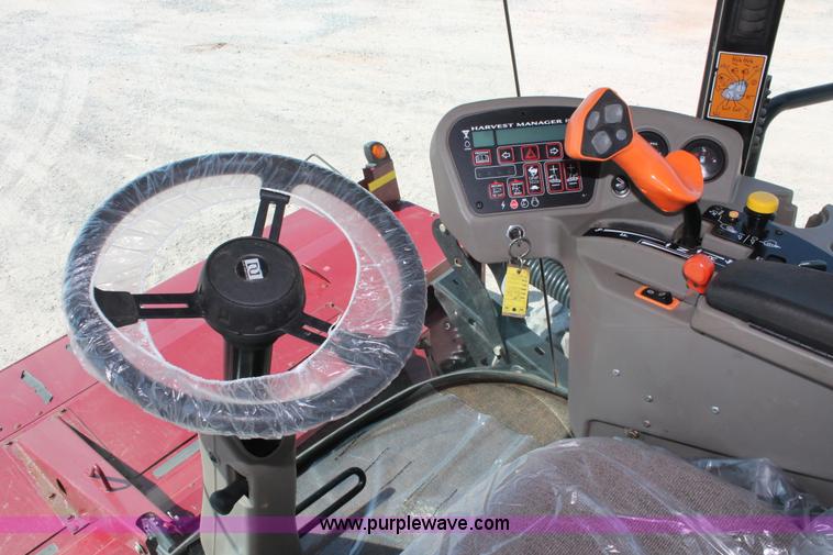 image for item H5859 2011 MacDon M205 self-propelled windrower